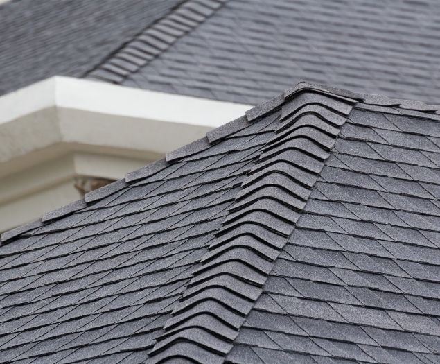 A closeup of a neatly installed shingle roof