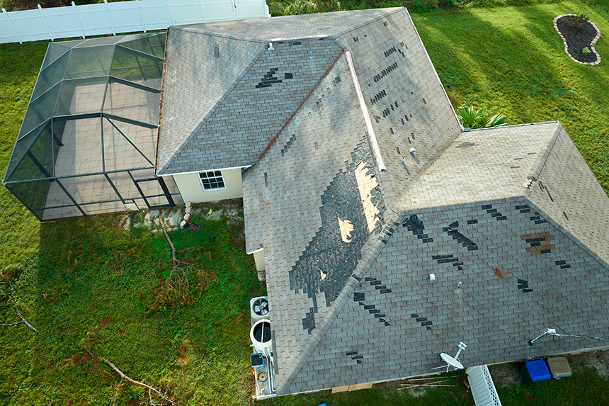Damaged Residential Roof In Need Of Inspection & Replacement