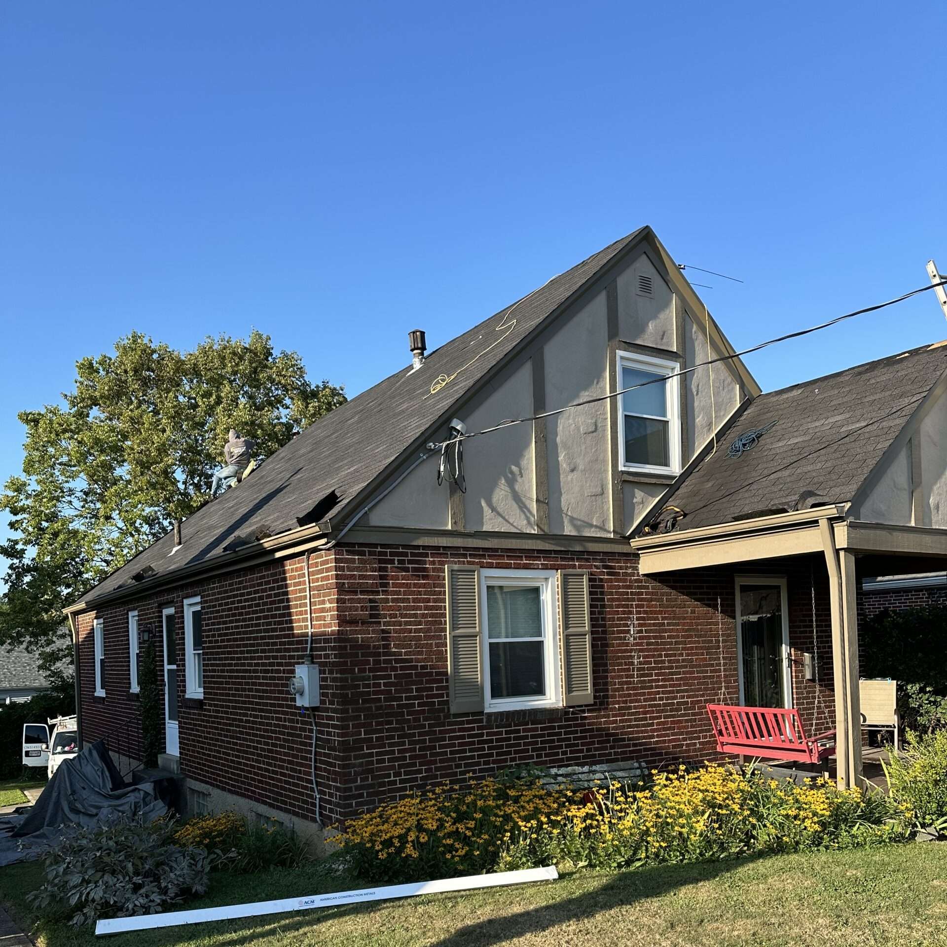 Full house before photo of a roof replacement in progress on home in Cincinnati, OH by Weather Stop Roofing