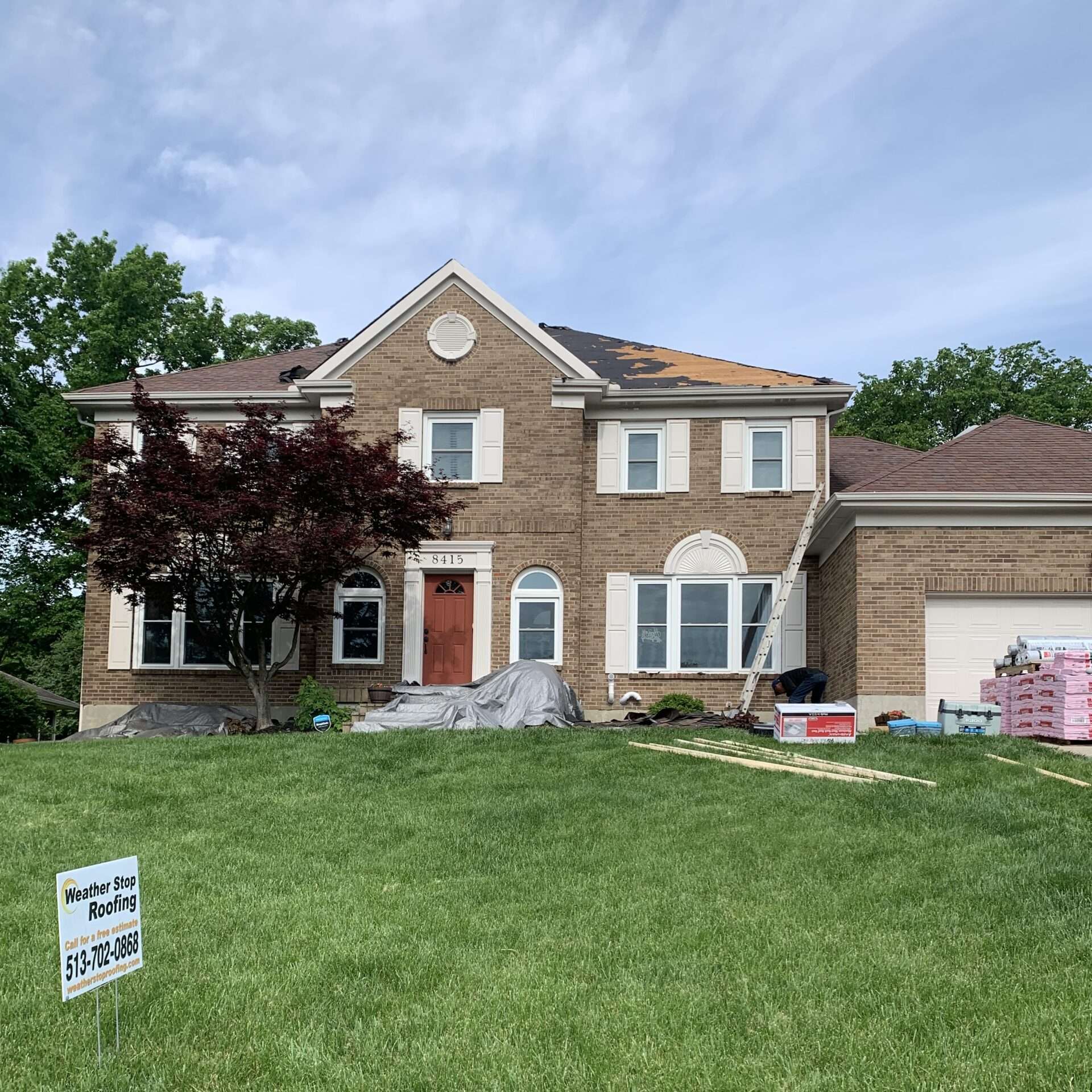 Full house before photo of a roof replacement in progress on home in West Chester, OH by Weather Stop Roofing