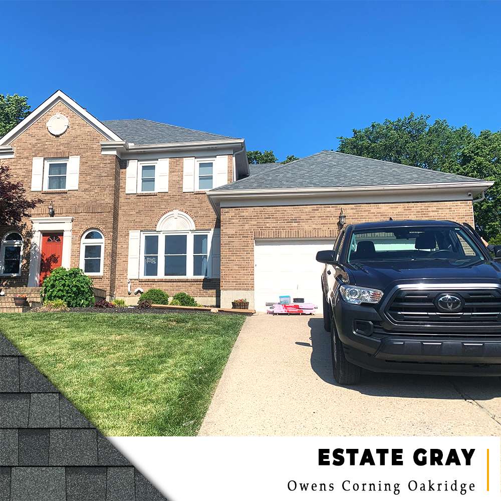 New Estate Gray Owens Corning TruDefinition shingle roof on a large two-story brick home with white accents in West Chester, Ohio.