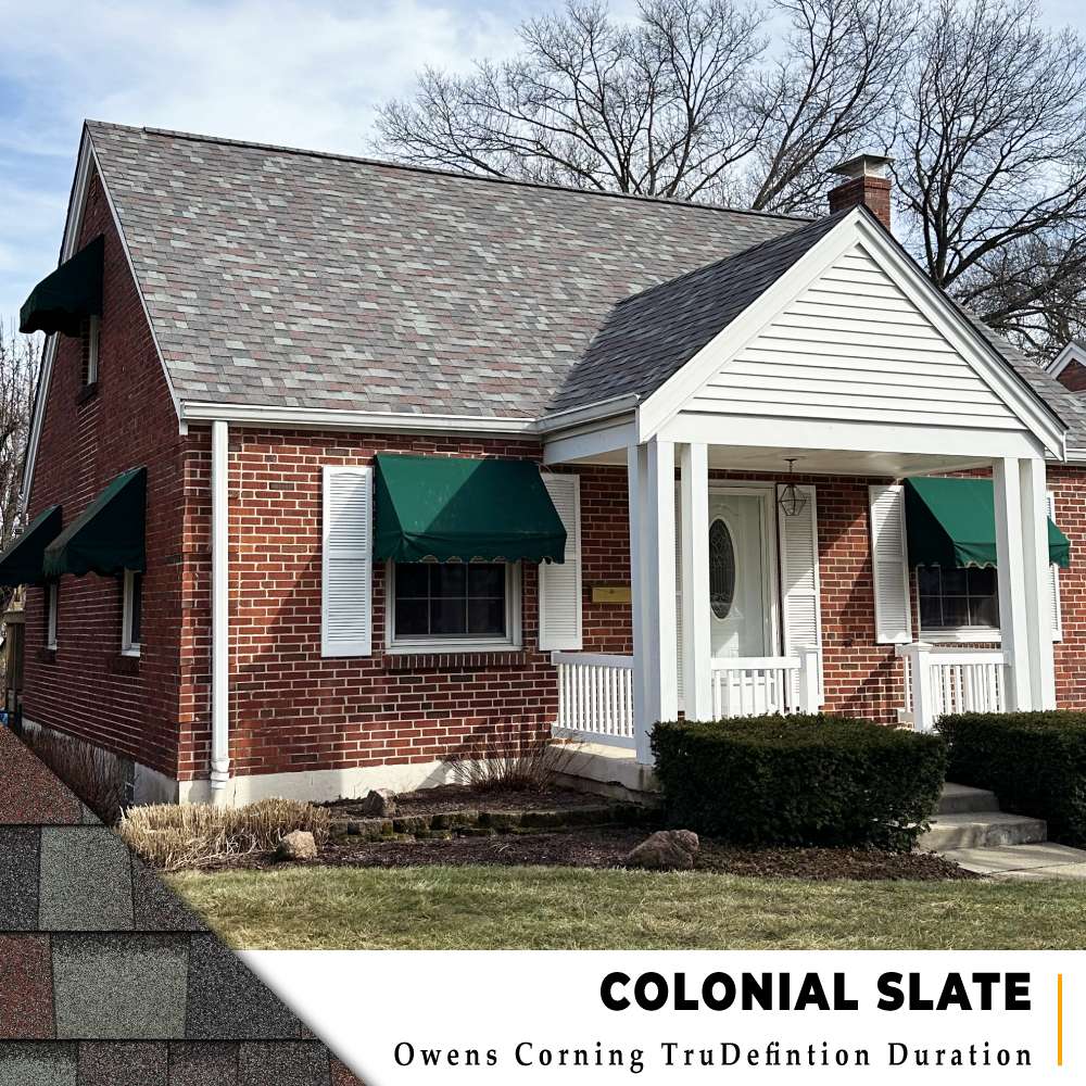 Colonial Slate architectural shingle roof installation on two story red brick home with green awnings in Cincinnati, Ohio.