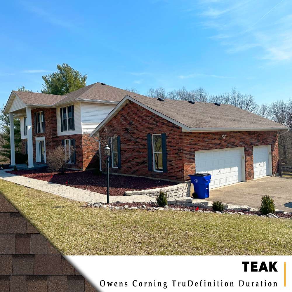 Teak Owens Corning TruDefinition Duration shingle roof installation on large two-story brick home with white siding in Hamilton, Ohio.