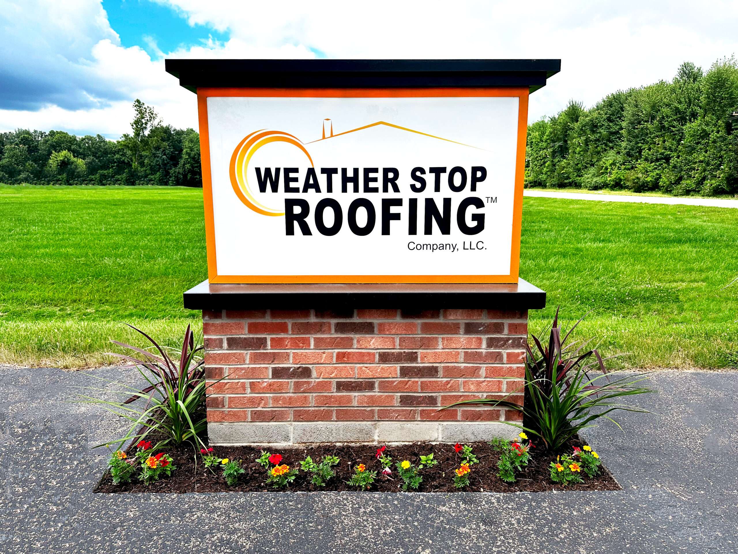 Permanent office signage for Weather Stop Roofing in Goshen, Ohio, highlighting our local family-owned location